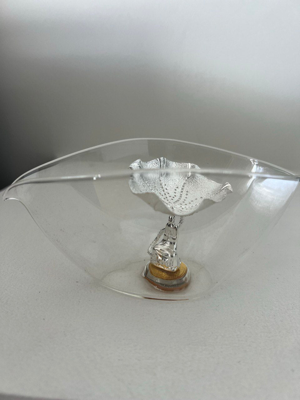 Drainer with a silver sieve